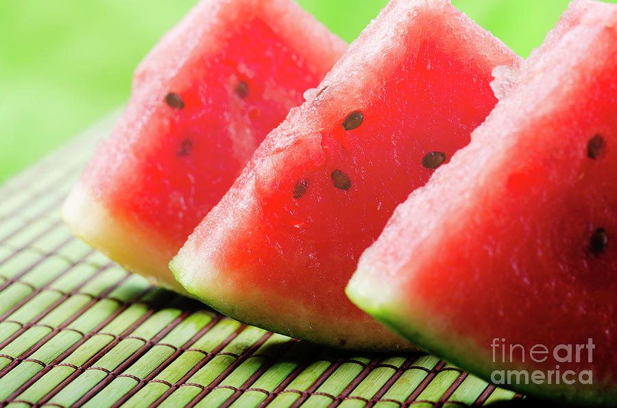Sweet Red Watermelon Slices On Green Table Photograph