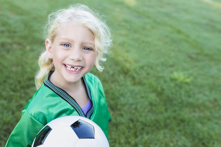 Sweet soccer girl with missing teeth Photograph by SDI Productions