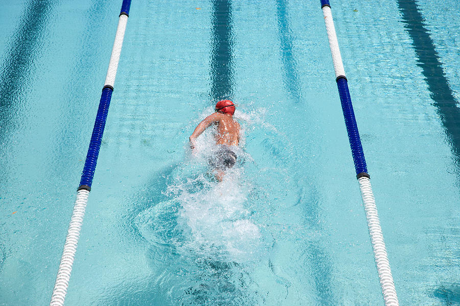 Swimmer swimming in a pool Photograph by Robert Daly