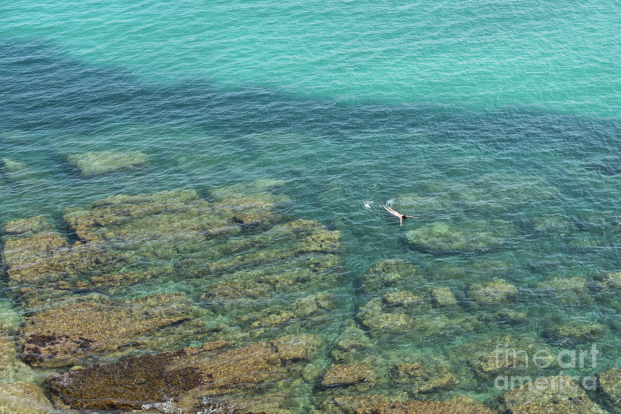 Swimming in clear, turquoise blue sea water Photograph by Adriana Mueller