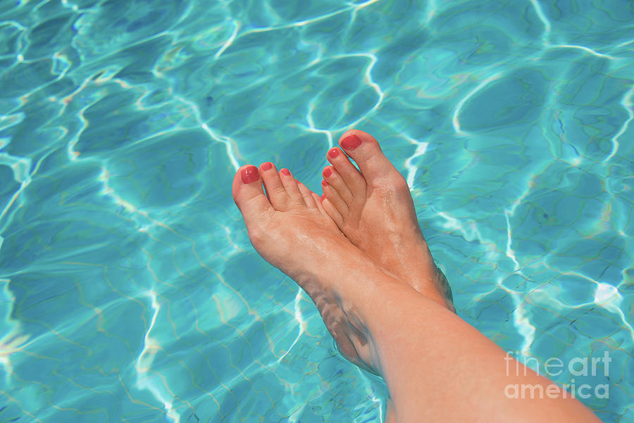 Swimming pool feet Photograph by Delphimages Photo Creations