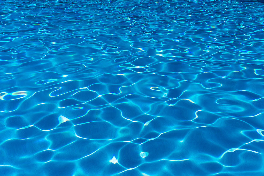 Swimming pool surface with patterns and ripples Photograph by Nora Carol Photography