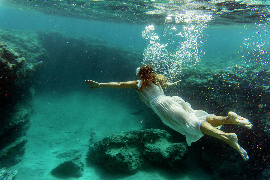 Summer Photograph - Swimming underwater by Manolis Tsantakis