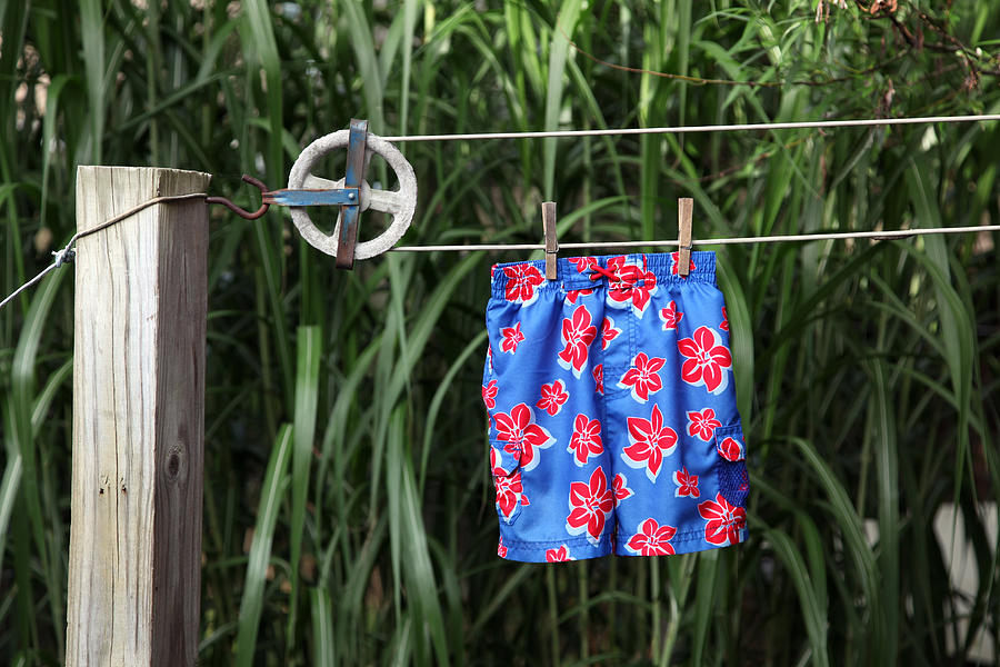 Swimsuit on Clothesline Photograph by DougSchneiderPhoto