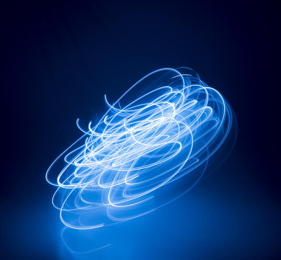 Swirling lights Photograph by PM Images
