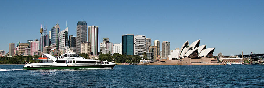 Sydney Opera House and the CBD skyline with a fast Rivercat Ferr Photograph by Geoff Childs