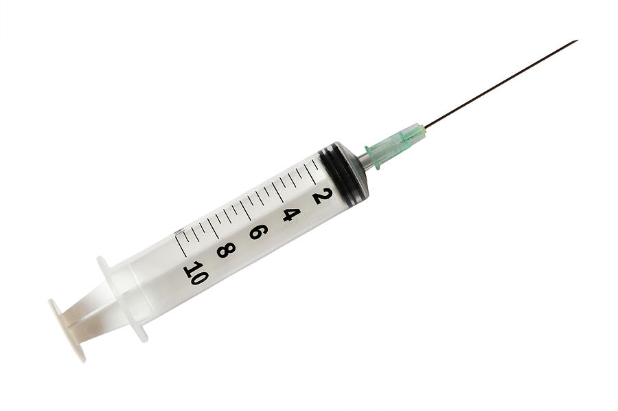 Syringe with needle. Photograph by AlesVeluscek