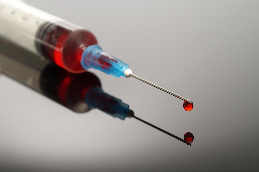 Syringe with red drop Photograph by Esben_H