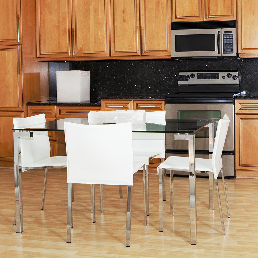 Table and chairs in modern kitchen Photograph by Camilo Morales