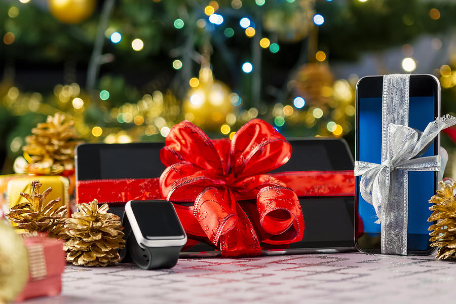 Tablet pc, smartphone and smartwatch for Christmas Photograph by Manaemedia