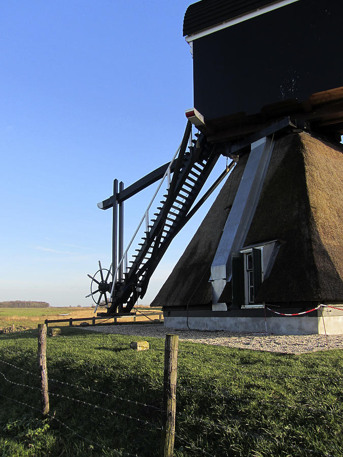 Tail of Dutch windmill Photograph by Roel_Meijer