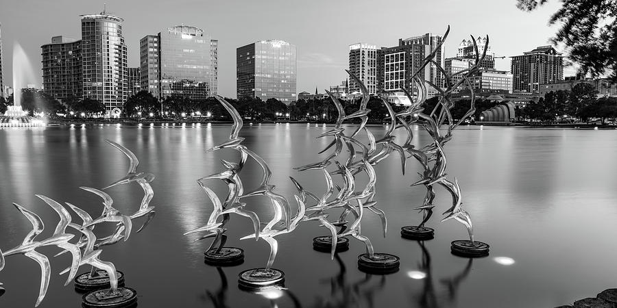 Orlando Skyline Photograph - Take Flight Statues Panoramic View of Lake Eola and Orlando Skyline in Black and White by Gregory Ballos