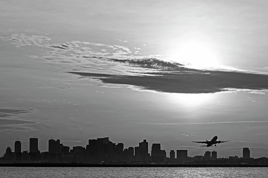 Taking off. Sunset over Boston MA and Logan Airport Black and White Photograph by Toby McGuire