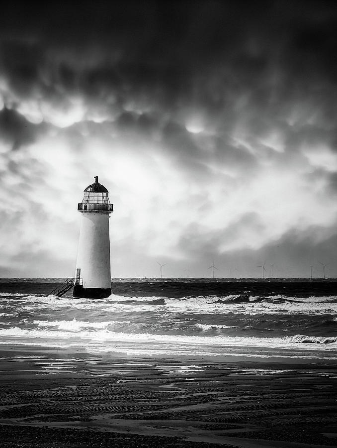 Talacre Lighthouse Under Stormy Skies - Black and White Photograph by Jason Fink