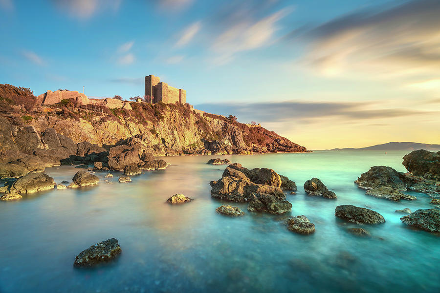 Talamone rocky beach and medieval fortress at sunset. Maremma Ar Photograph by Stefano Orazzini