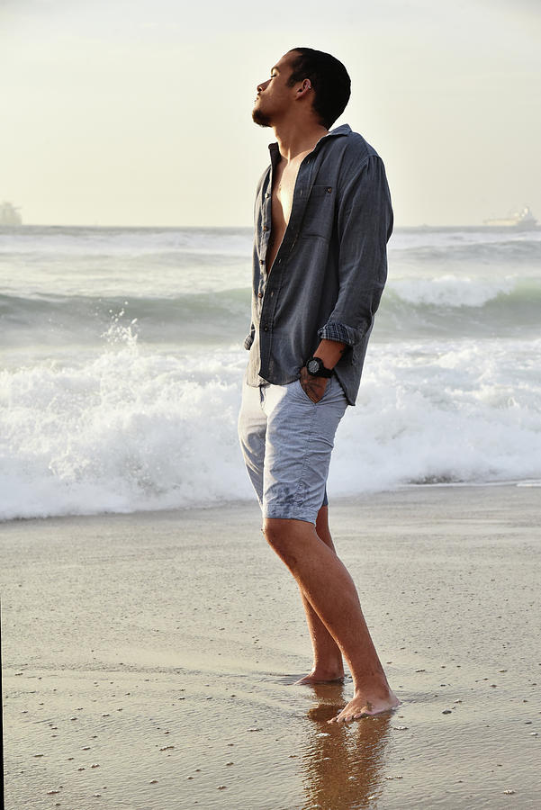 Tall slender young man enjoying the beach stock photo Photograph by Mark Stout