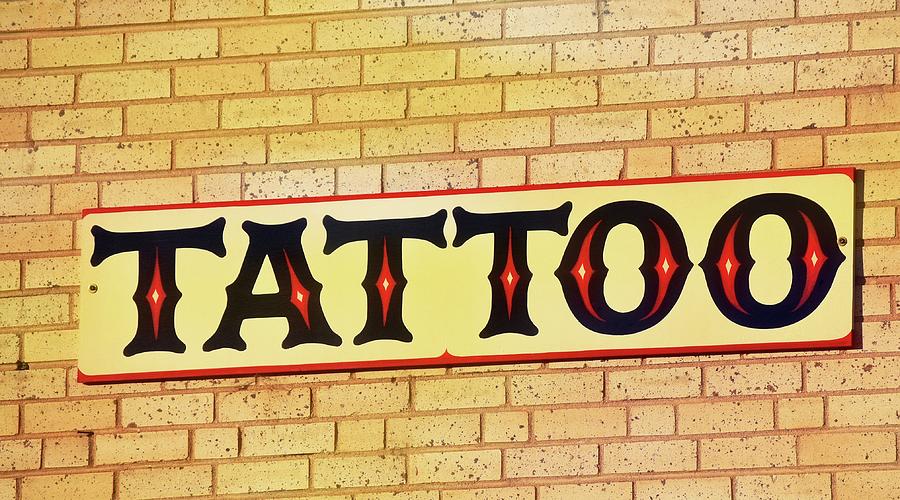 Tattoo shop sign Photograph by Bob McDonnell
