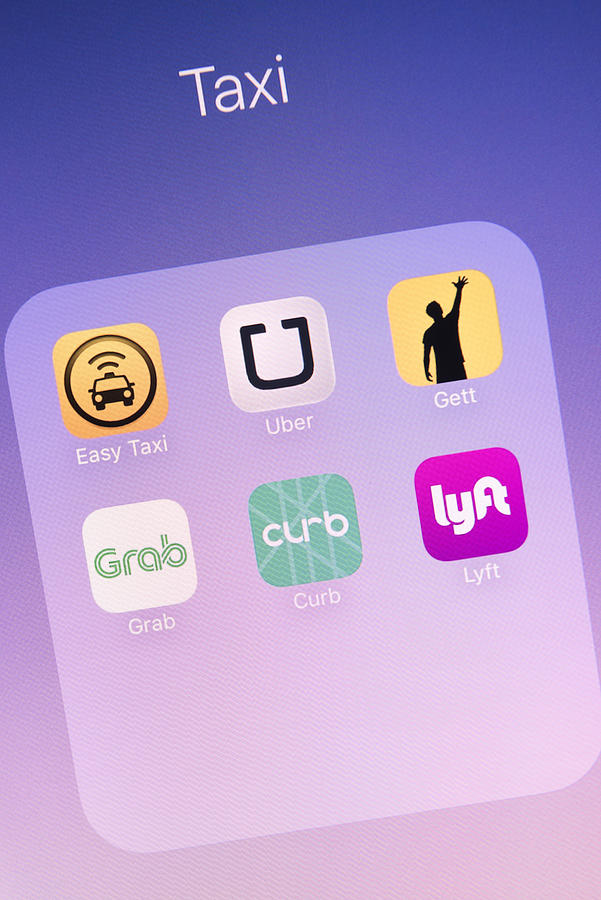 Taxi Apps on Apple iPhone 6s Plus Screen Photograph by Temizyurek