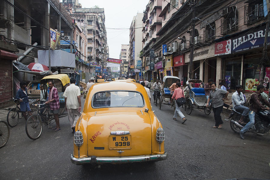 Taxi cab in Kolkakta (Calcutta) on crowded street Photograph by Buena Vista Images