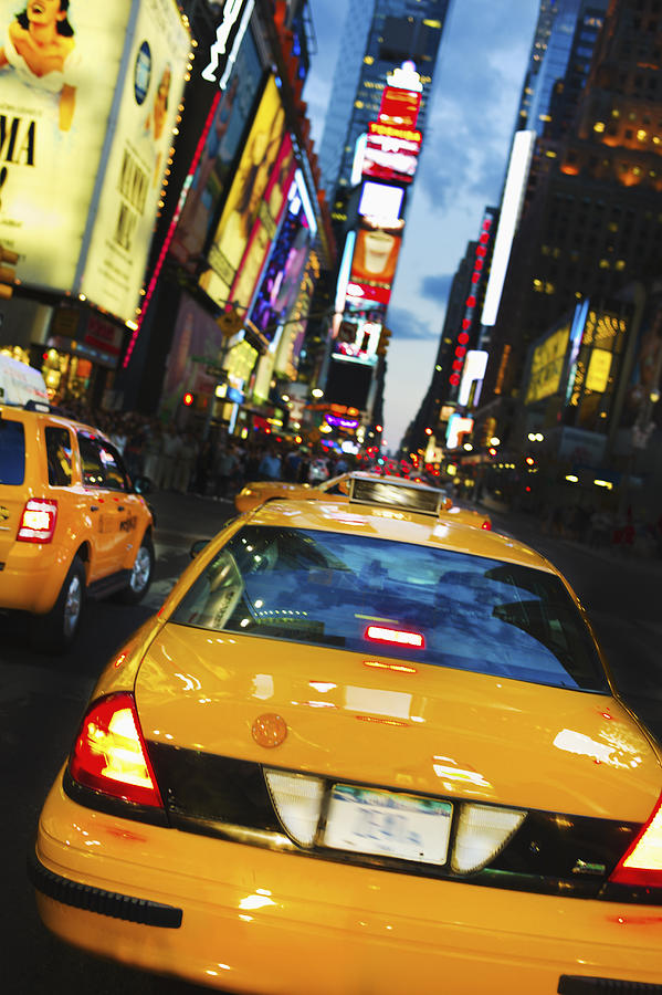 Taxi in Times Square Photograph by Tetra Images