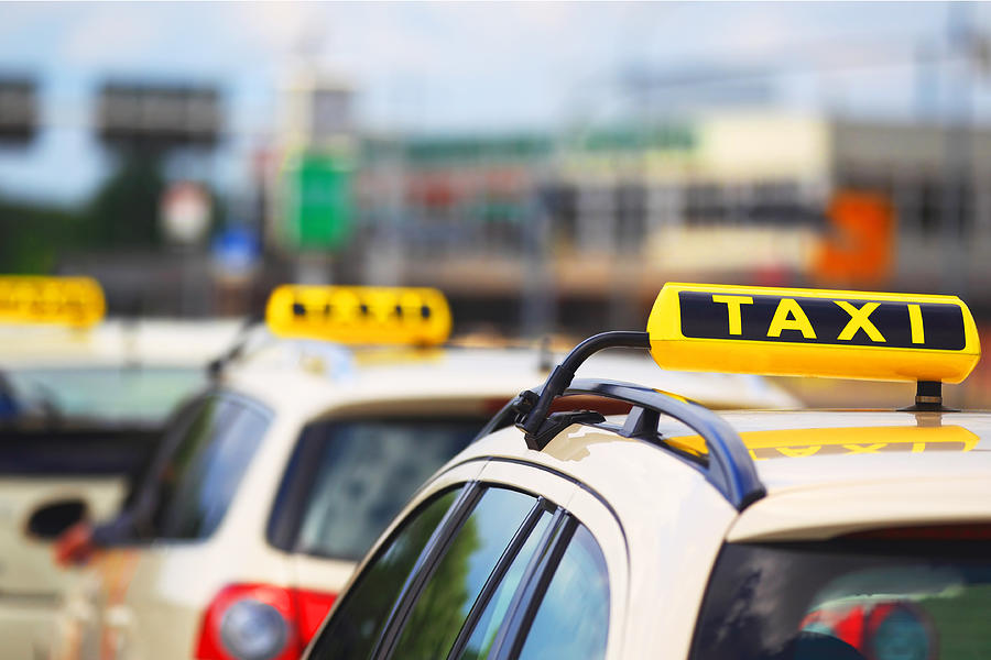 Taxi signs - cars waiting for passenger Photograph by Fhm