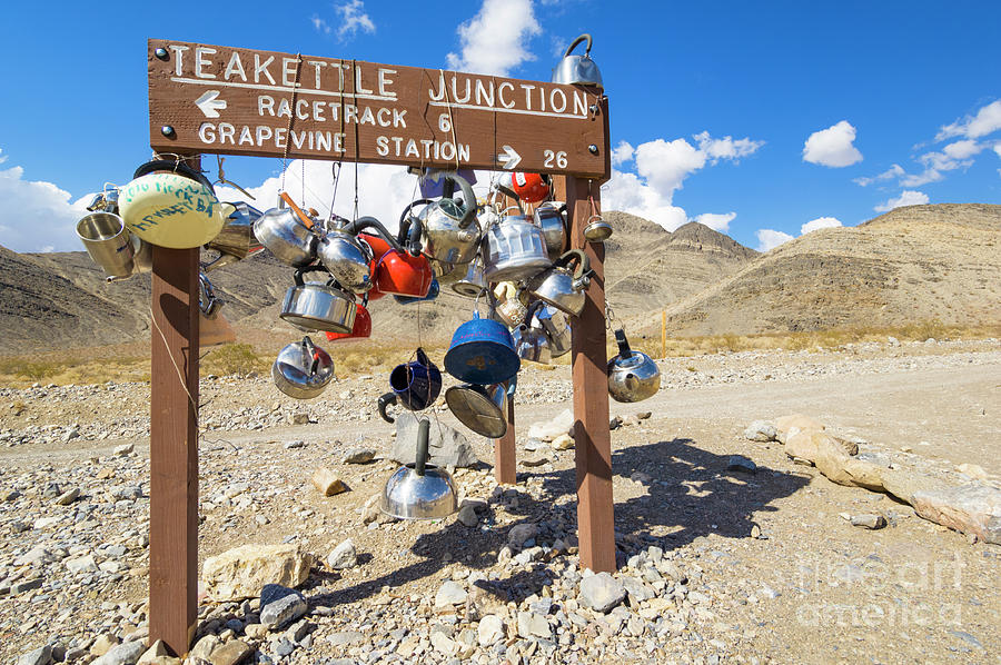 Teakettle Junction and road sign covered by kettles and pans, Death Valley National Park, California Photograph by Neale And Judith Clark