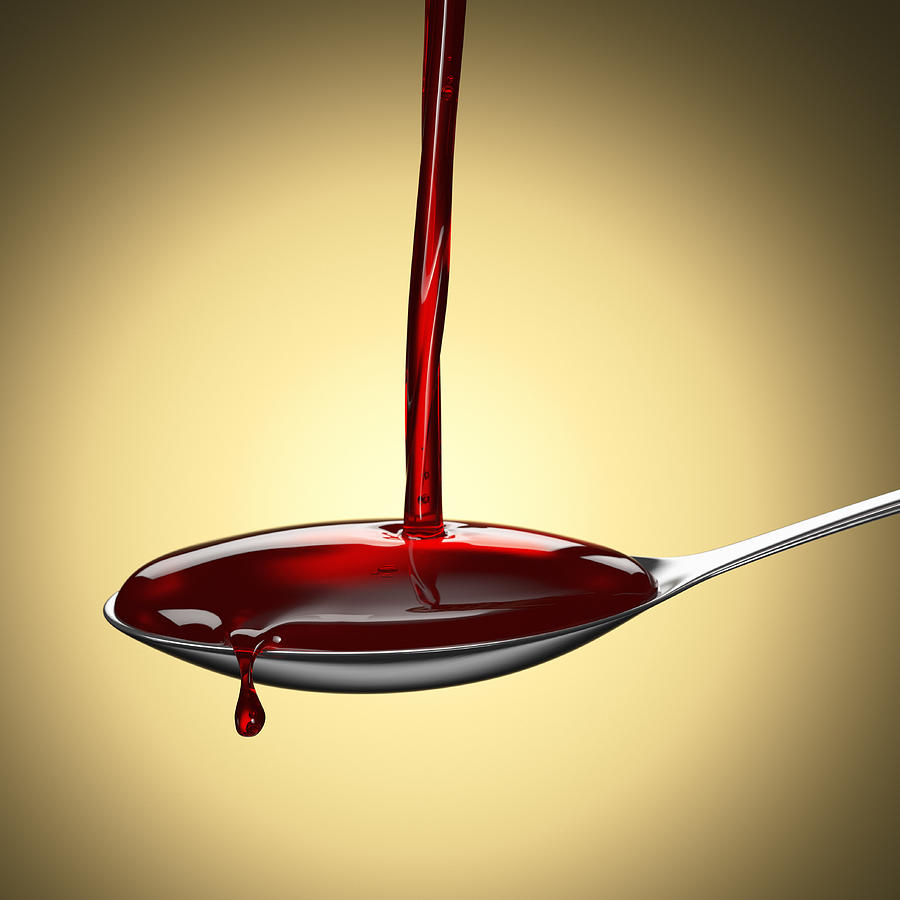 Teaspoon catching pouring red liquid medicine Photograph by I Like That One