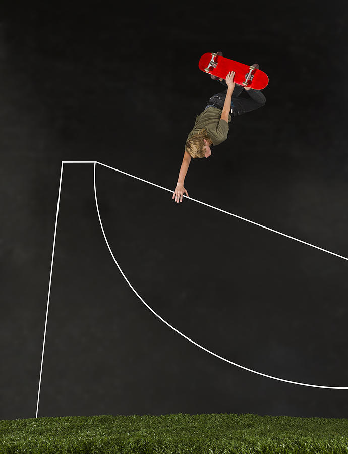 Teenage boy (14-15) skateboarding in half pipe Photograph by Ryan Richardson