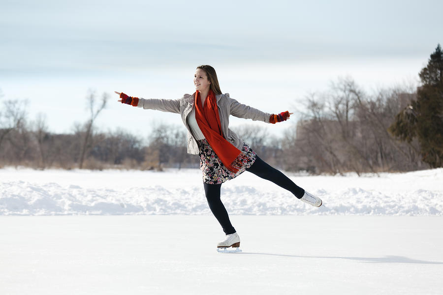 Teenage Girl Figure Skating on Winter Lake Ice Rink, Minneapolis Photograph by YinYang