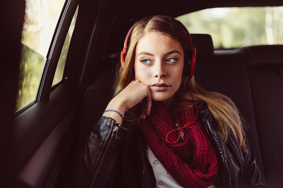 Teenage girl on a road trip with car Photograph by Martin Dimitrov