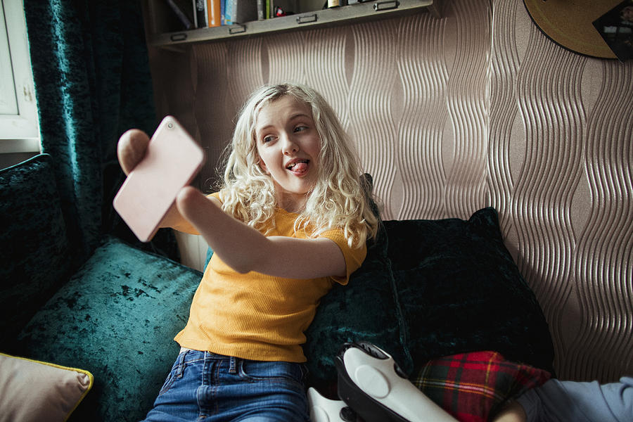 Teenage Girl Taking A Selfie Photograph by SolStock
