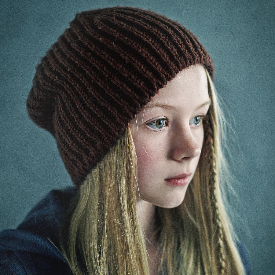 Teenage girl wearing knitted cap Photograph by Vladimir Serov