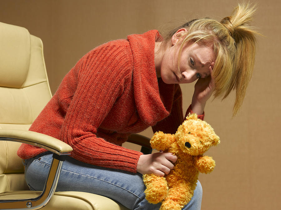 Teenage mother with depression Photograph by Peter Dazeley
