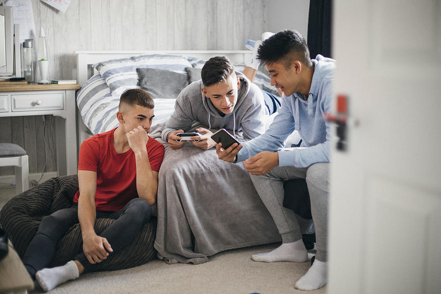 Teens Using Social Media Photograph by SolStock