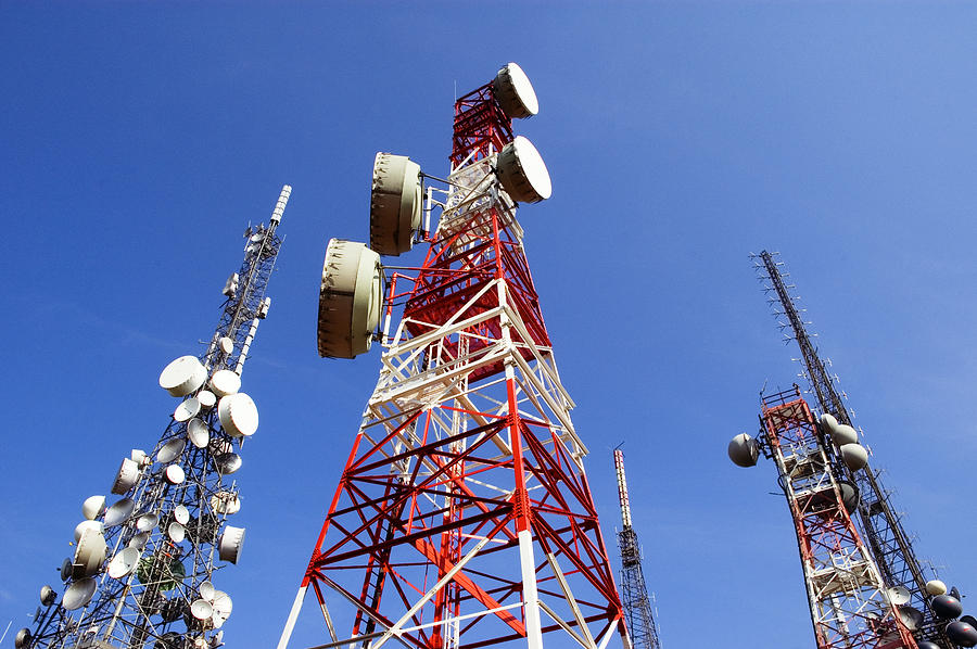 Telecommunications Tower, blu skye with clouds Photograph by Maumapho