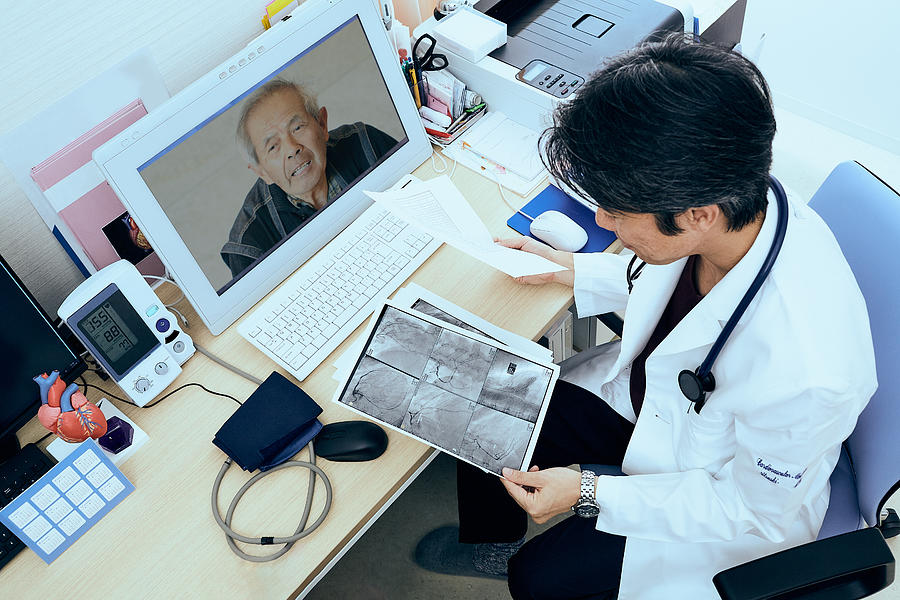 Telemedicine doctors and patients Photograph by Yoshiyoshi Hirokawa