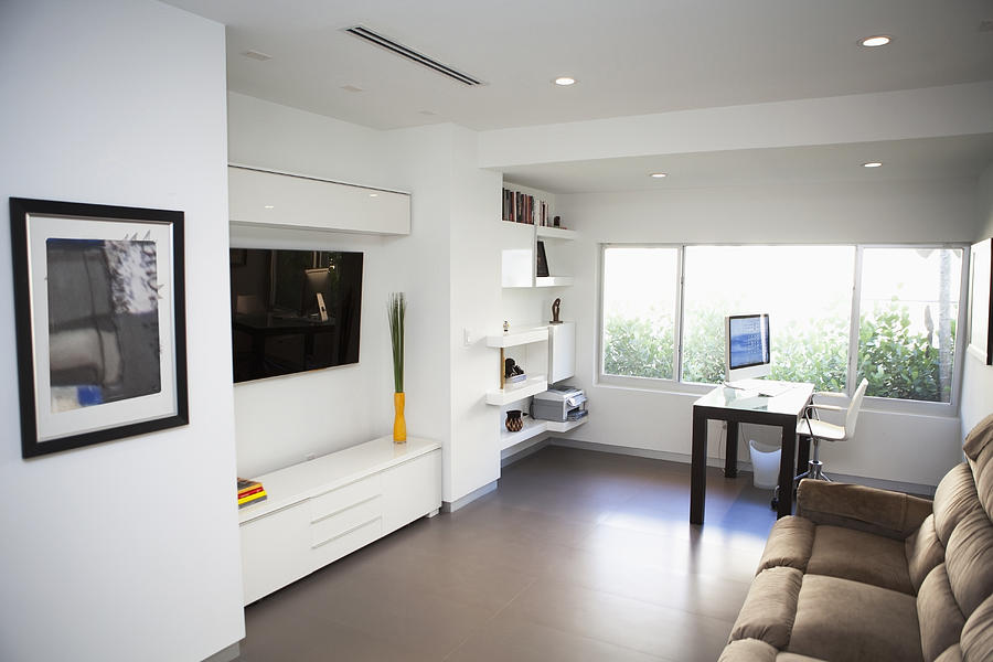 Television, sofa and windows in modern living room Photograph by Camilo Morales