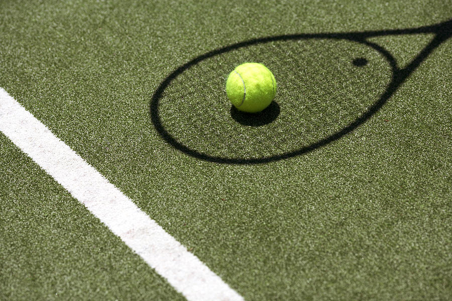 Tennis ball with racket shadow on court Photograph by Marc Debnam
