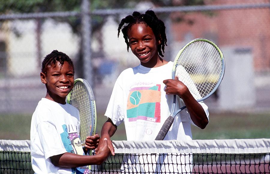 Tennis players Venus and Serena Williams practice in 1991 in Compton Photograph by Paul Harris