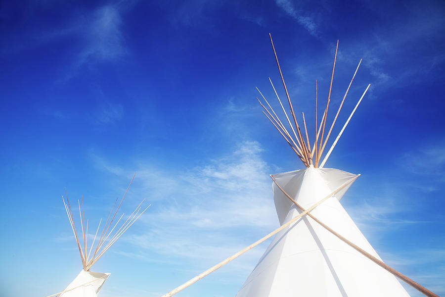 Tepees gather light Photograph by Toni Hopper