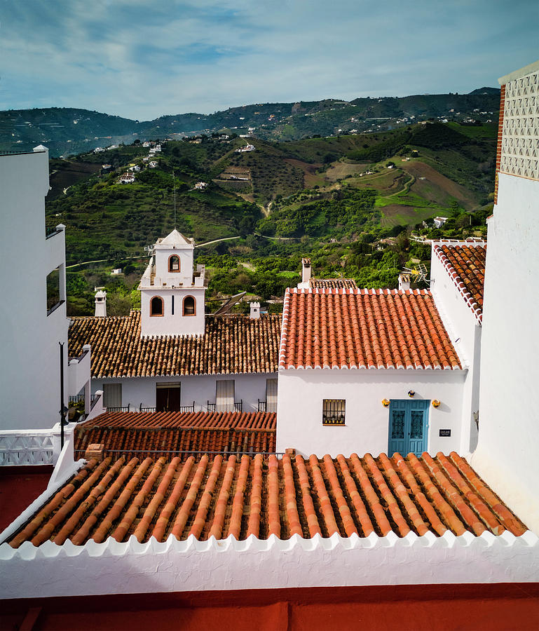 Terracotta roo tiles on the rooftops of Frigiliana new village, with the distant campo, Malaga Photograph by Panoramic Images