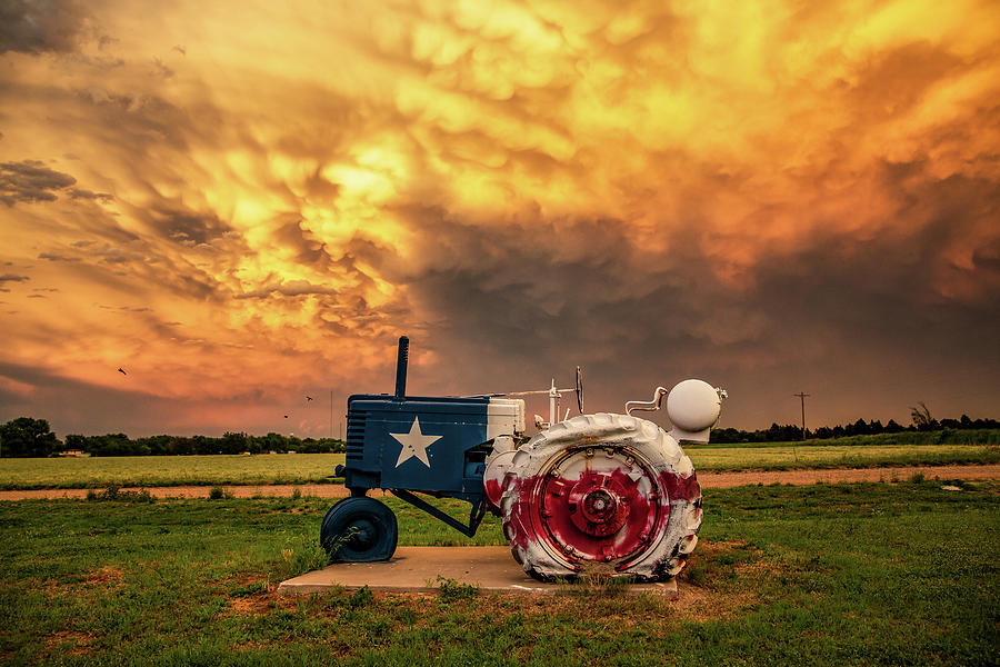 Sunset Photograph - Texas Tractor - Tractor Painted as State Flag Under Stormy Sky by Southern Plains Photography