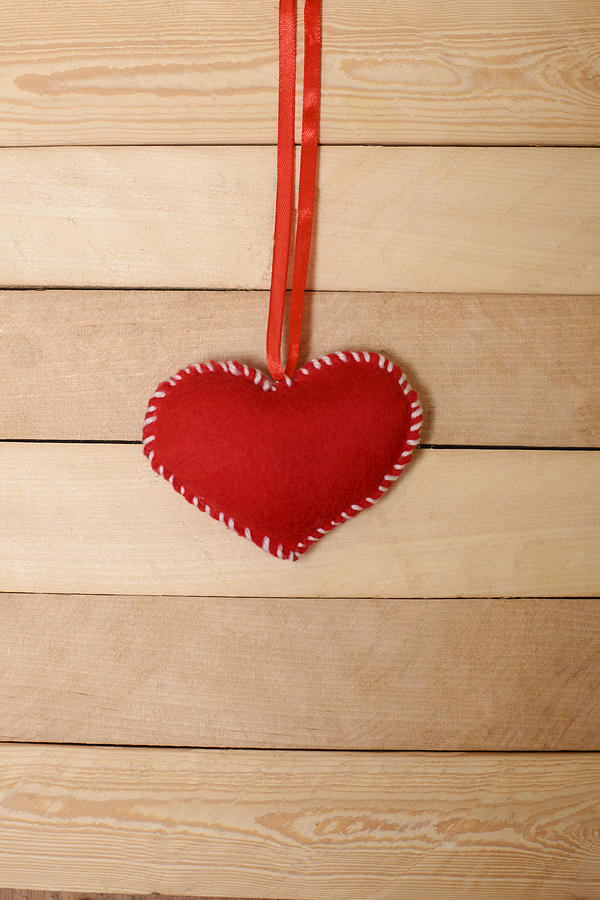 Textile red heart  on a wooden texture Photograph by Foxline