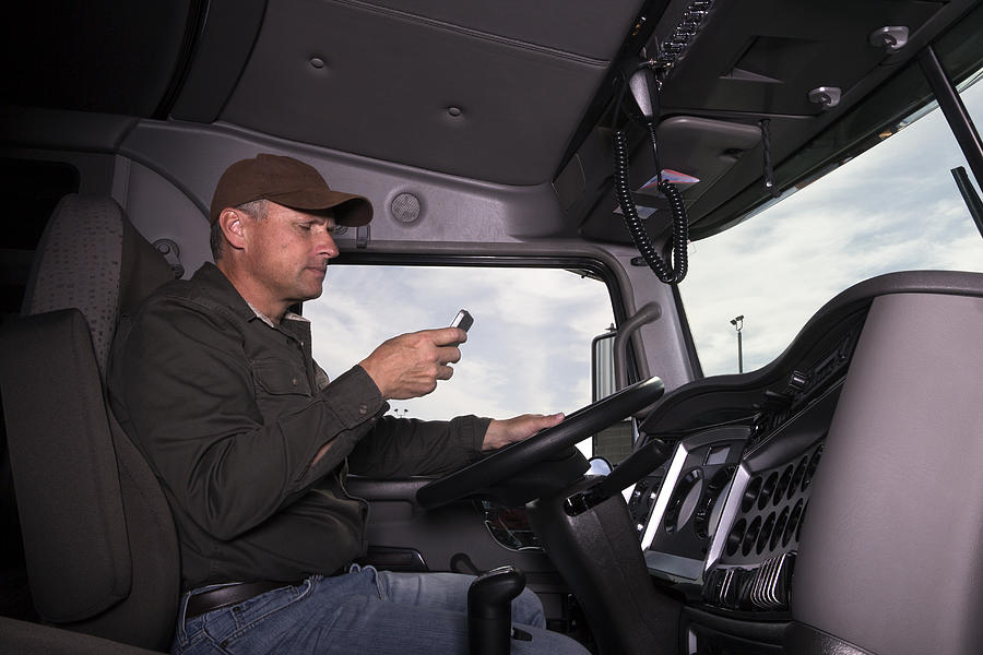 Texting and trucking Photograph by Shotbydave