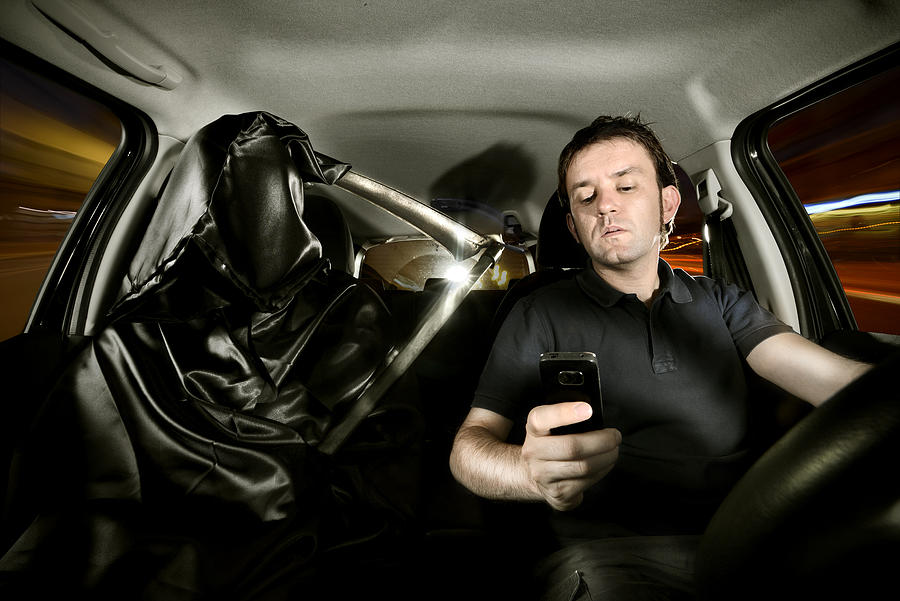 Texting while driving Photograph by Ilbusca