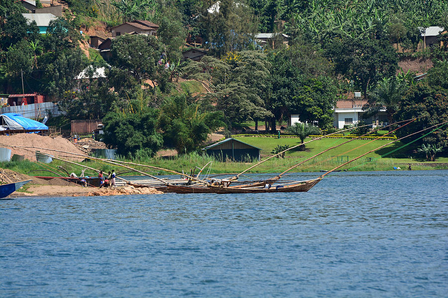 Th traditional three-hulled fishing boats in the Rubona Cove on lake Kivu Photograph by Michele DAmico supersky77