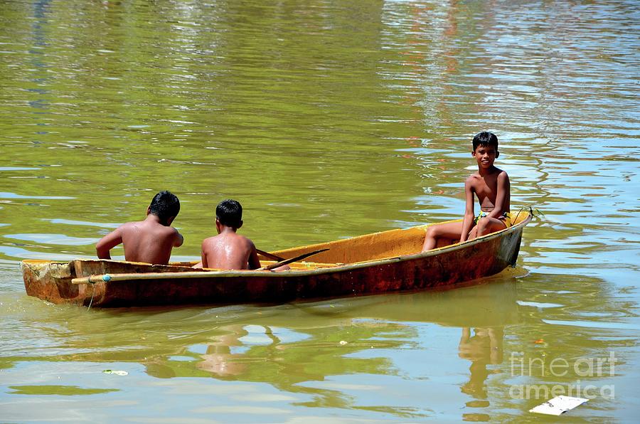 Boat Photograph - Thai boys on boat in fish harbor Pattani Thailand by Imran Ahmed