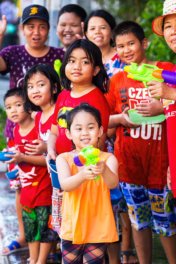 Thai children and women at Songkran Photograph by Justhavealook