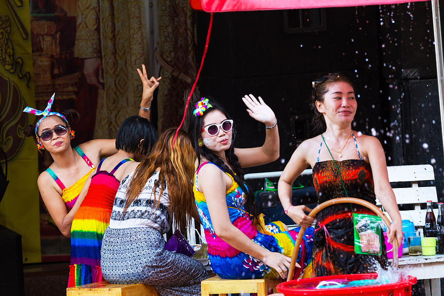 Thai women having Songkran party on sidewalk Photograph by Justhavealook