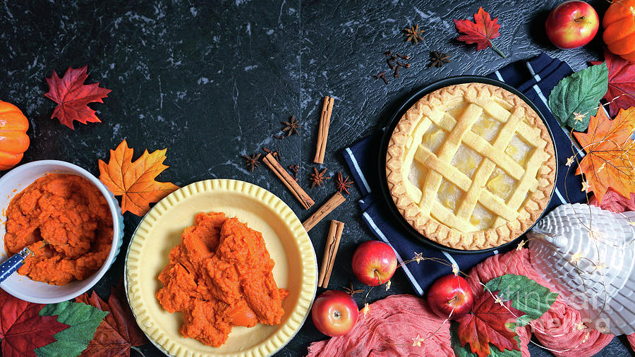 Thanksgiving apple and pumpkin pies on dark marble background. Photograph by Milleflore Images